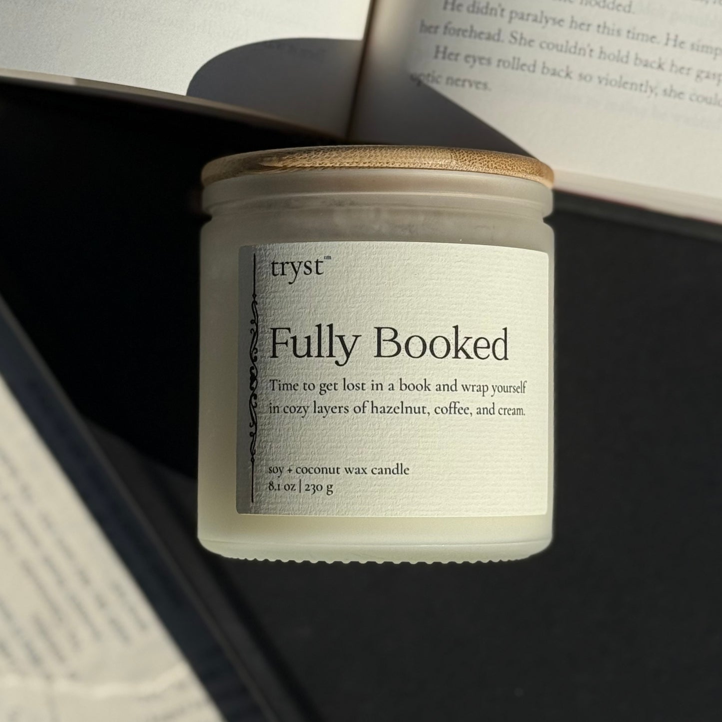 Fully Booked Candle by Tryst Candle House - hazelnut coffee and cream scent, book-inspired candle for morning reading.