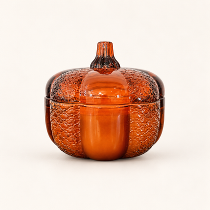 Large Pumpkin candle in a textured amber glass pumpkin jar with a stem-handled lid